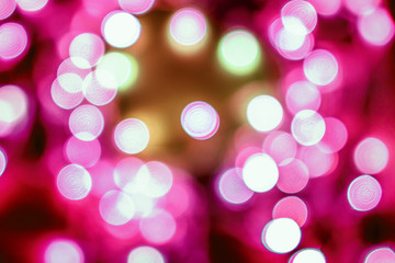 Pink festive Christmas elegant abstract background with bokeh lights