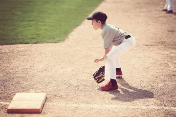 Boy ready at first base © soupstock