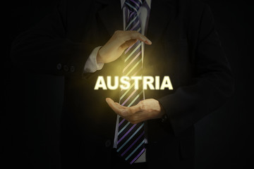 Businessman protects a Austria word