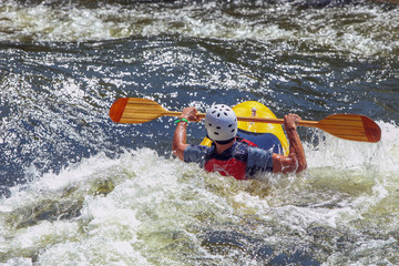 Kayaker on rough water