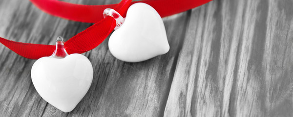 Two hearts and wooden background