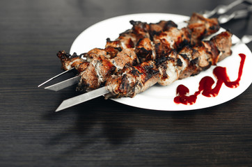 shish kebab on white plate