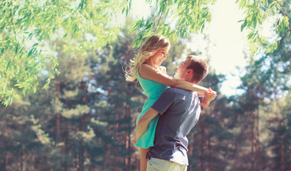 Happy young couple in love hugging enjoys spring day, loving man