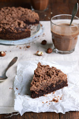 Chocolate Crumble Pie, Hazelnut Brownie on Beige and Wooden Background