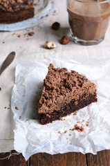Chocolate Crumble Pie, Hazelnut Brownie on Beige and Wooden Background