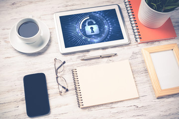 Web security and technology concept with tablet pc on wooden tab