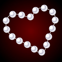 white necklace in the shape of heart