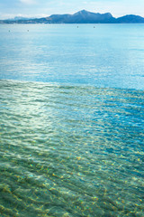 sky leaving for horizon above a blue surface of the sea