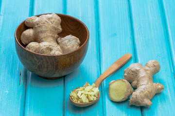 Ginger root sliced on wooden table