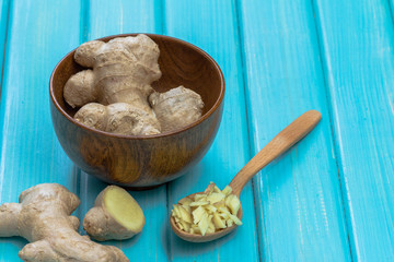 Ginger root sliced on wooden table