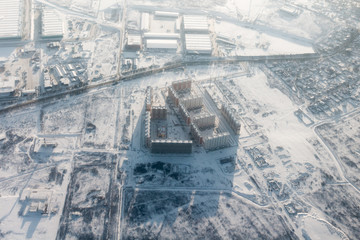 Aerial view of multi-storey houses district at winter