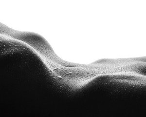 Sexy female body with drops of water