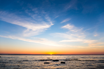 Bright sky and water at sunset