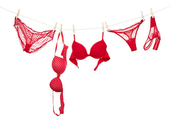 Female panties and bra hanging on rope
