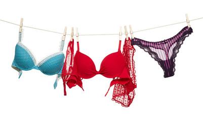 Female panties and bra hanging on rope