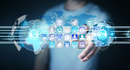 Businessman connecting worlds to icons and applications software