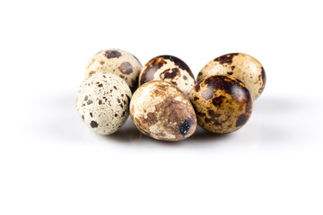 Quail eggs on white