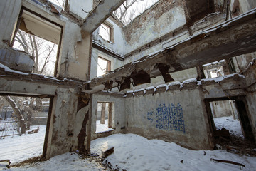 Fototapeta na wymiar destroyed house after an earthquake, snow disaster, house fire
