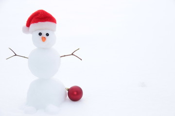 Winter background with a snowman, snow and snowflakes