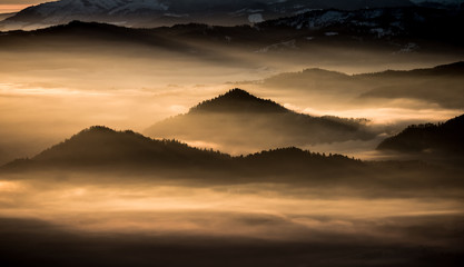 Misty mountains landscape in the morning, Poland