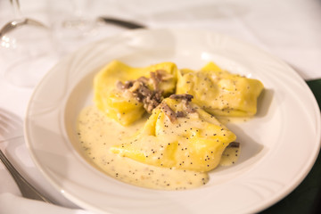 Tasty pasta dumplings with mushrooms