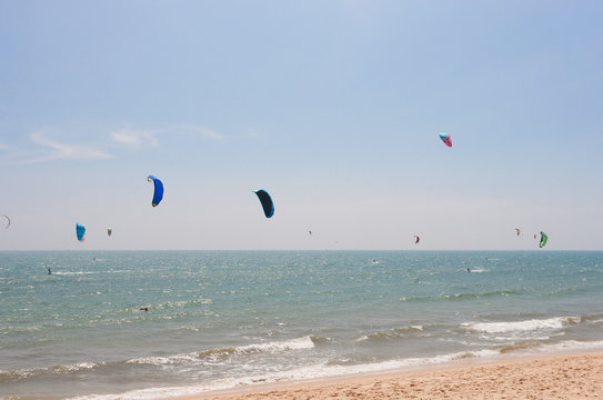 Unidentified people involved in kitesurfing