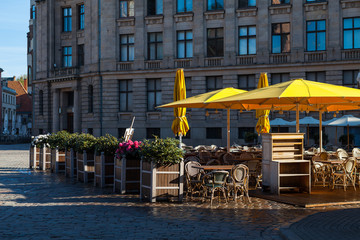 Fototapeta na wymiar Street cafe on the square of old town (Riga, Latvia)
