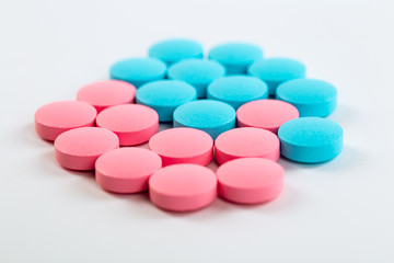 Various cold prescription bottles and a syringe isolated on a wh