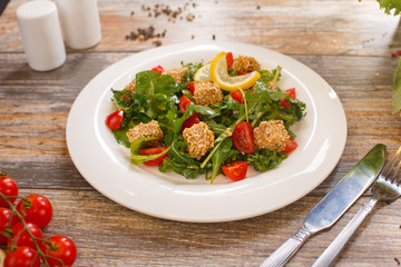 salad of arugula with cherry tomatoes and croutons
