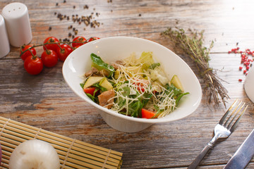 salad of arugula with cherry tomatoes and croutons