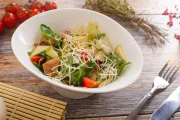 salad of arugula with cherry tomatoes and croutons