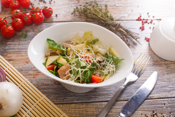 salad of arugula with cherry tomatoes and croutons