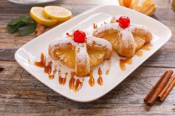 Baked buns with a cherry and pineapple