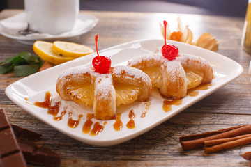 Baked buns with a cherry and pineapple