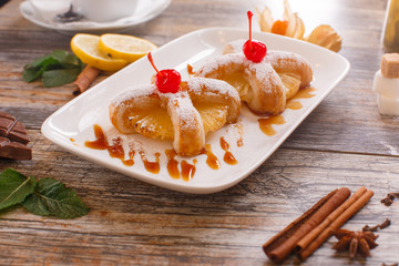 Baked buns with a cherry and pineapple