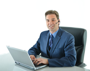 Business man on a call while working on laptop up or customer service representative helping people