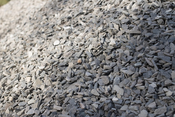 Crushed grey stone.