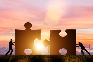 Business concept of teamwork with jigsaw puzzle