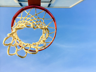 Sport playground with basketball ring on blue sky outdoors background