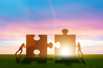 Business metaphor of teamwork with jigsaw puzzle