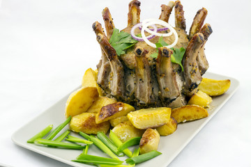 Crown roast of pork with potato wedges