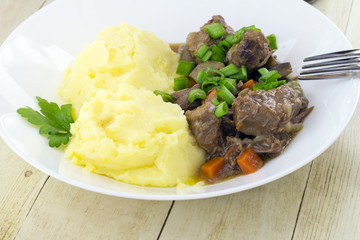 Beef and beer Irish stew with mashed potatoes
