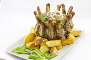 Crown roast of pork with potato wedges
