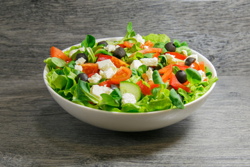 Greek salad with lettuce, tomatoes and olives