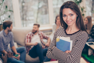 Portrait of young beautiful manager woman holding notes