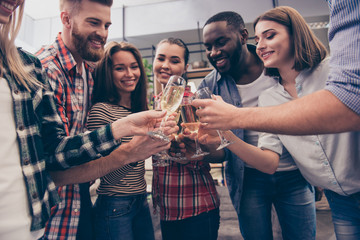 Happy best friends having a drink together in office