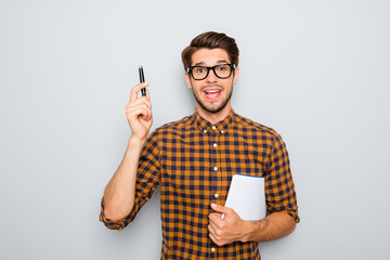Smart  student in glasses  with great idea holding notebook and