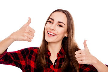 Cheerful young brunette woman showing both thumbs up