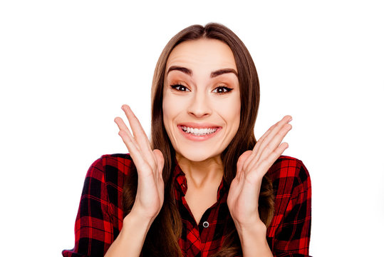Portrait of excited happy shocked young brunette woman