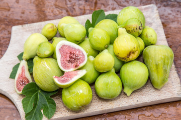 Ripe fig fruits on the wooden table.